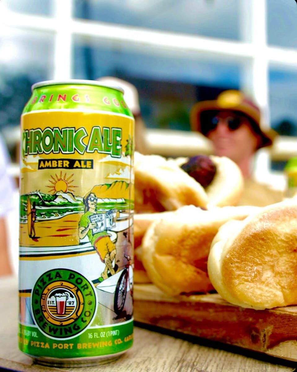 Chronic Ale can on a table with fresh bread at a Pizza Port brewpub