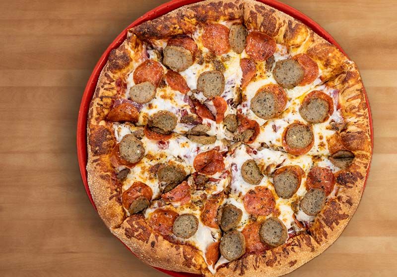 An Anti Wimpy Pizza loaded with meats