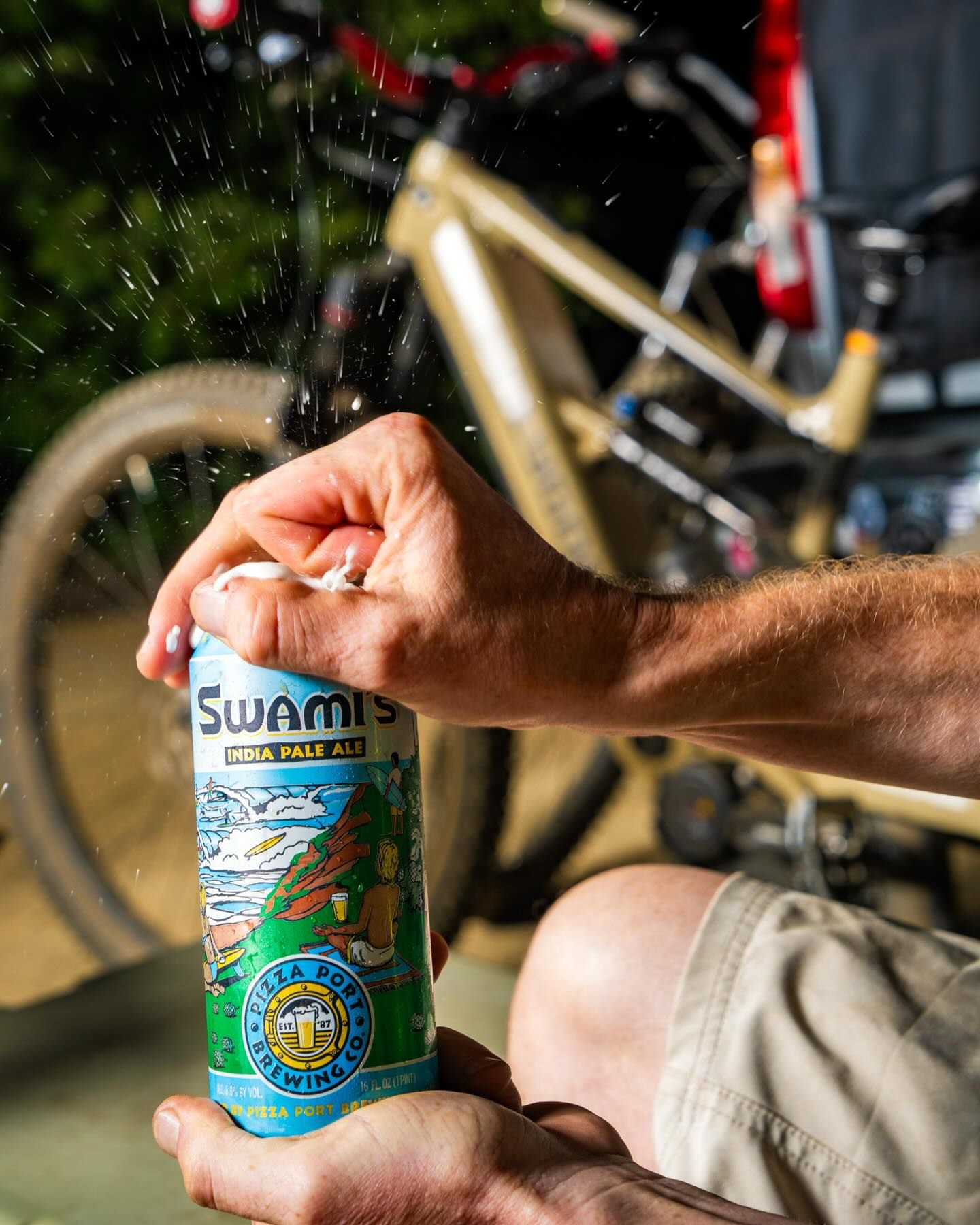 Cracking open a Swami's IPA on a bike ride